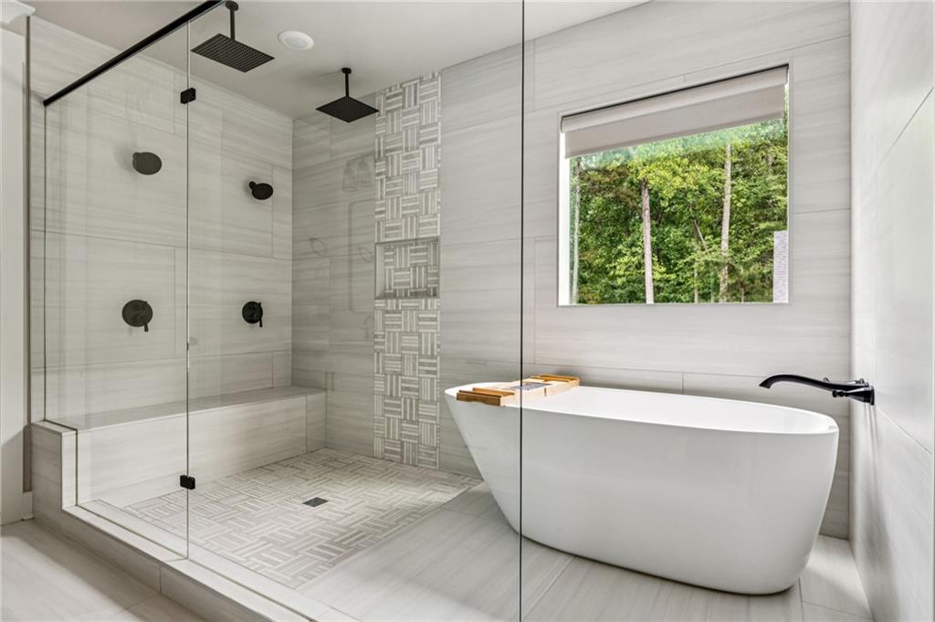 6326 Point Twenty Two Gainesville, GA 30506 - Photo 38 of 92 a white bath tub sitting next to a shower