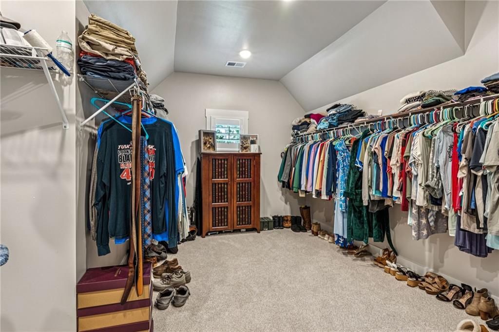 6326 Point Twenty Two Gainesville, GA 30506 - Photo 39 of 92 a view of walk in closet with clothes