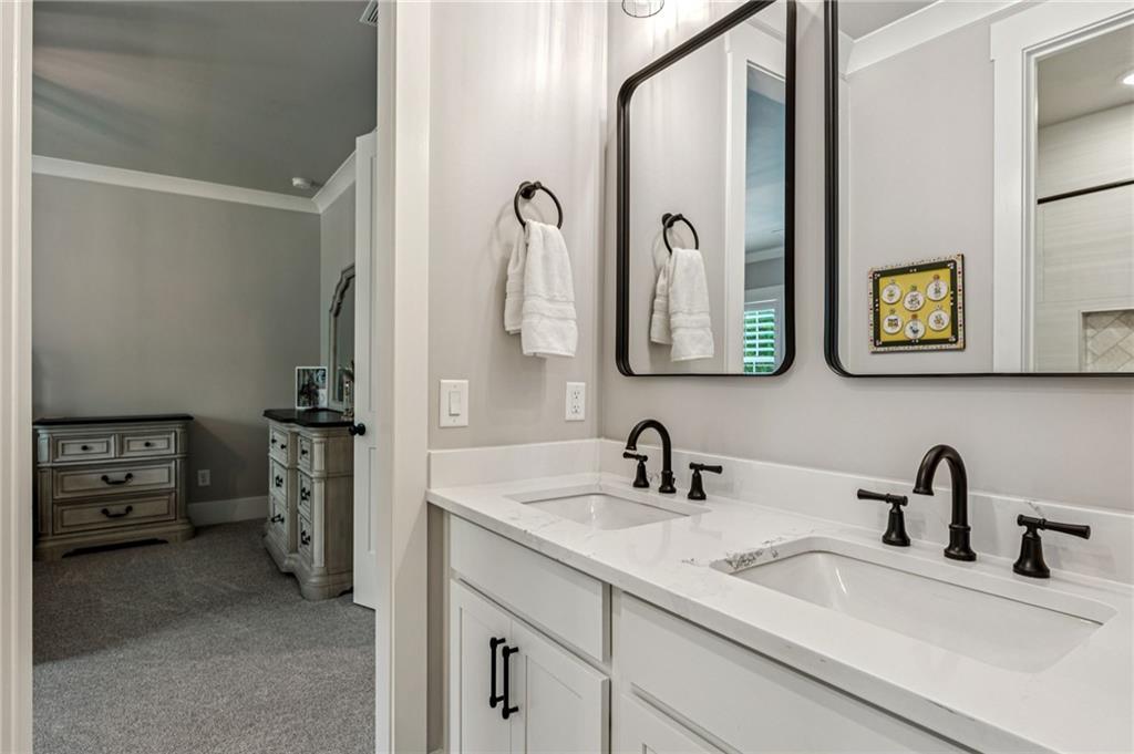 6326 Point Twenty Two Gainesville, GA 30506 - Photo 43 of 92 a bathroom with a double vanity sink and two mirror