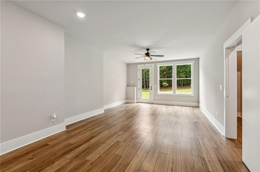 6326 Point Twenty Two Gainesville, GA 30506 - Photo 47 of 92 wooden floor in an empty room with a window