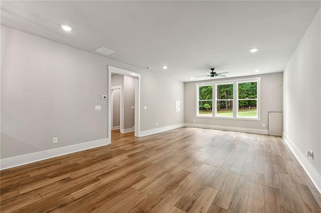 6326 Point Twenty Two Gainesville, GA 30506 - Photo 48 of 92 an empty room with wooden floor and windows