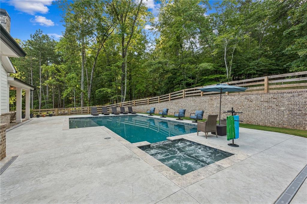 6326 Point Twenty Two Gainesville, GA 30506 - Photo 59 of 92 a view of a swimming pool with a patio