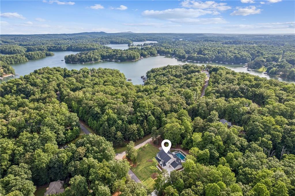 6326 Point Twenty Two Gainesville, GA 30506 - Photo 6 of 92 an aerial view of a golf course with a lake view