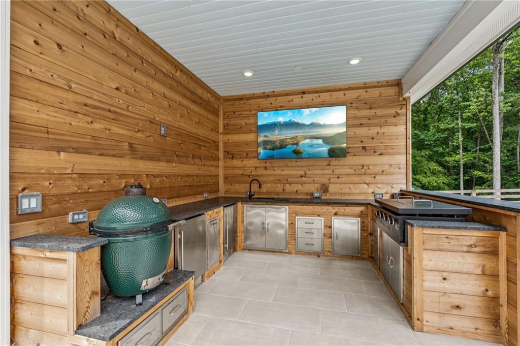 6326 Point Twenty Two Gainesville, GA 30506 - Photo 61 of 92 a kitchen with stainless steel appliances a stove and a sink