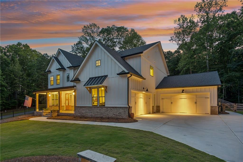 6326 Point Twenty Two Gainesville, GA 30506 - Photo 72 of 92 a view of a big house with a big yard and large trees