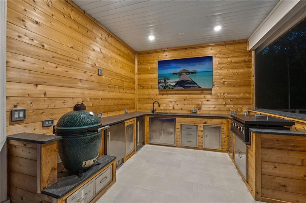 6326 Point Twenty Two Gainesville, GA 30506 - Photo 75 of 92 a kitchen with stainless steel appliances a stove a sink and a microwave
