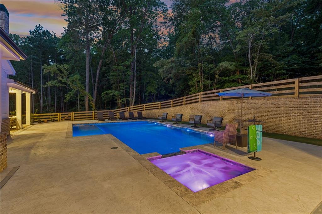 6326 Point Twenty Two Gainesville, GA 30506 - Photo 76 of 92 a view of a tennis ground with large trees