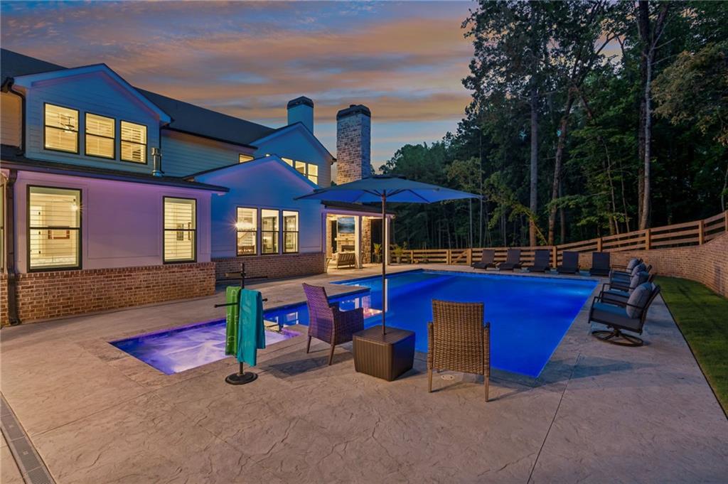 6326 Point Twenty Two Gainesville, GA 30506 - Photo 77 of 92 a front view of a house with swimming pool and porch