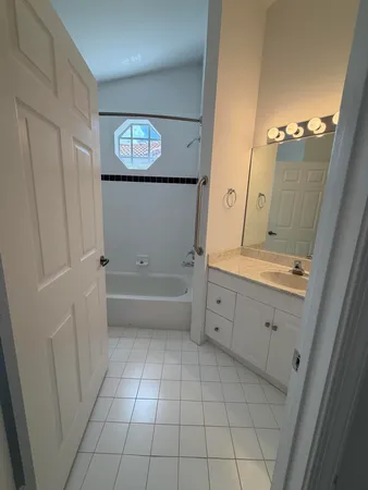 a view of an empty room with a yard and garage