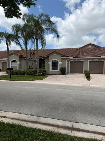 a view of the house with a yard