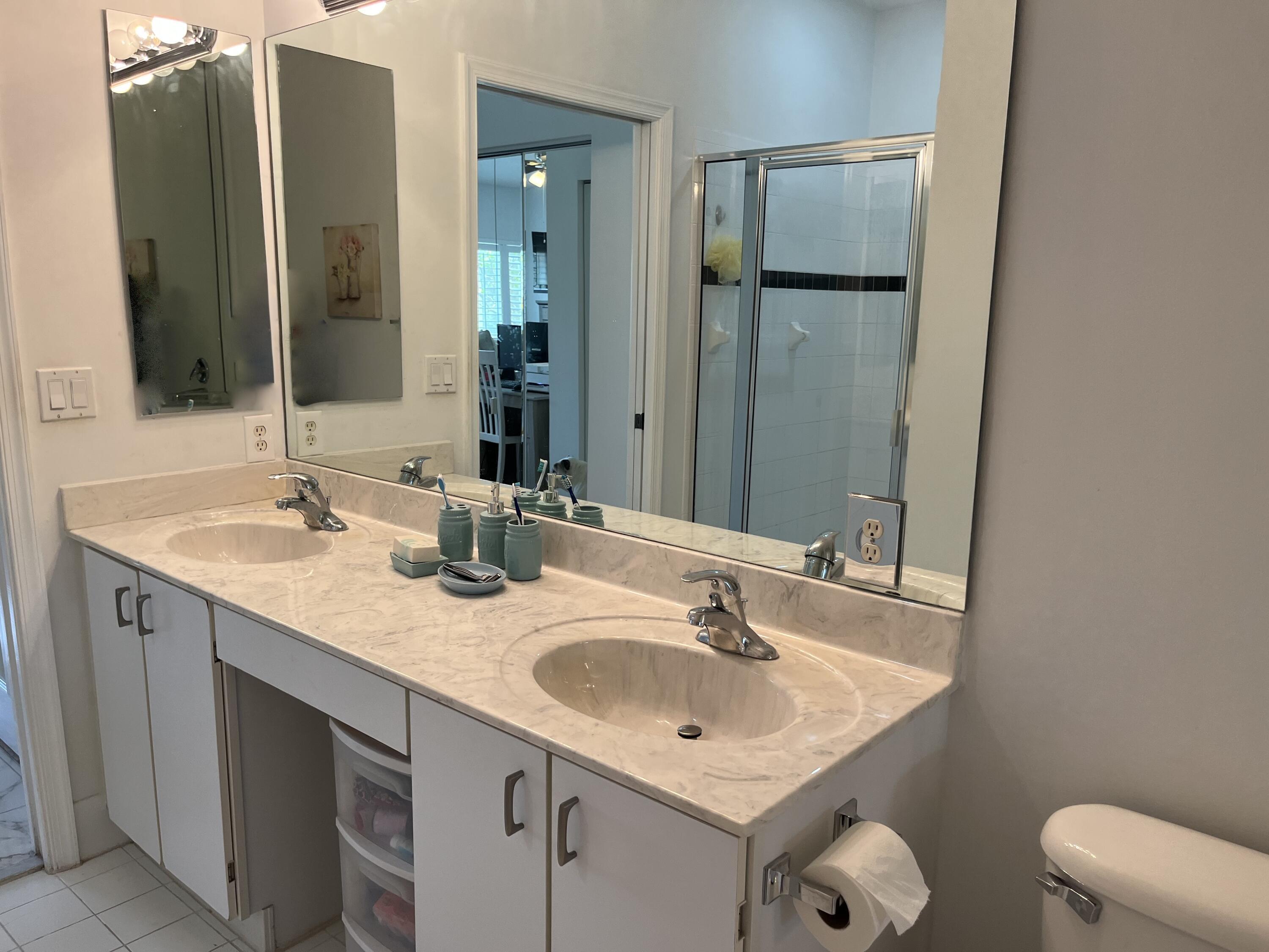 21105 Vía Solano Boca Raton, FL 33433 - Photo 9 of 14 a bathroom with a sink and a mirror
