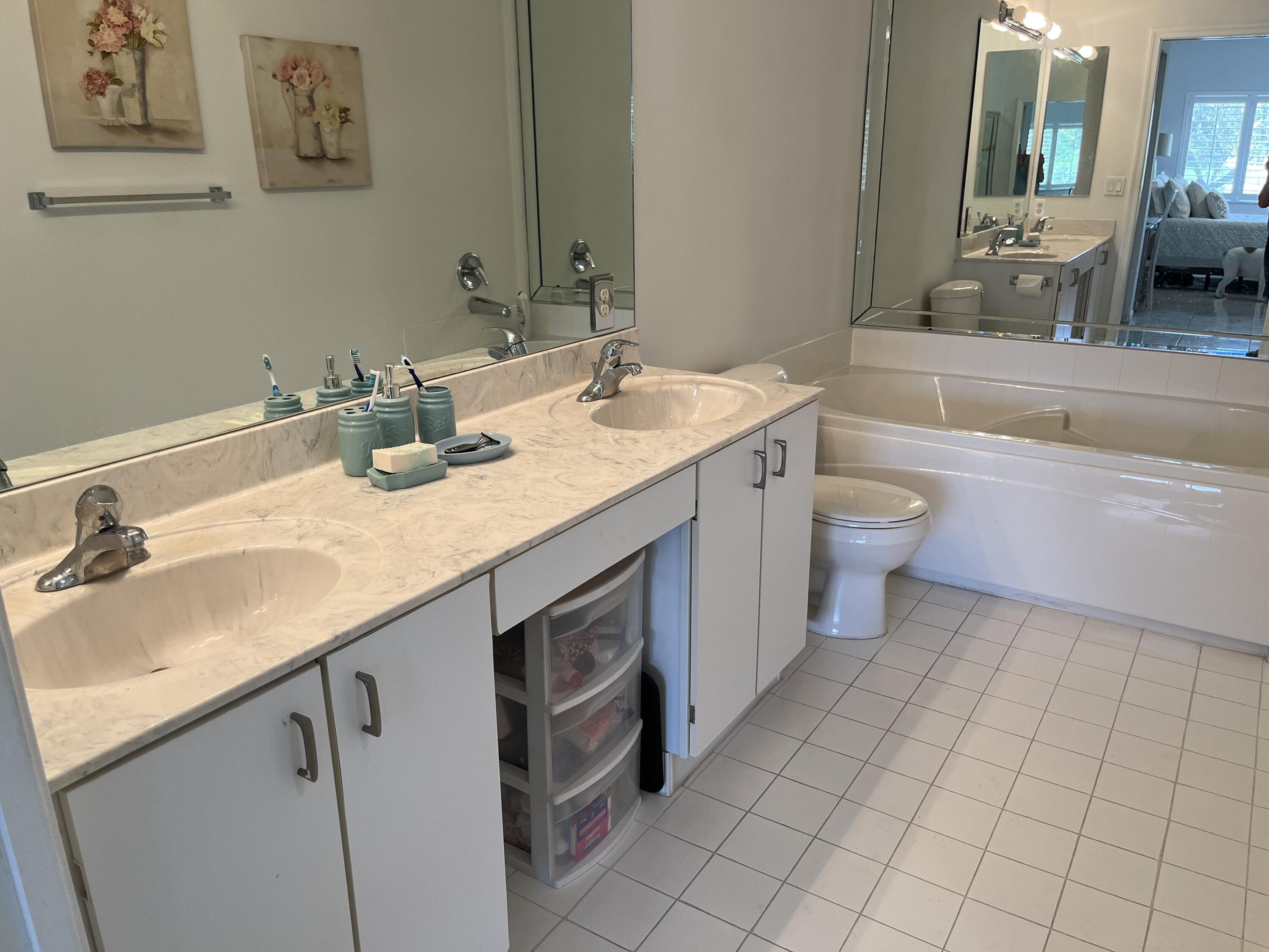 21105 Vía Solano Boca Raton, FL 33433 - Photo 10 of 14 a bathroom with a granite countertop sink mirror vanity and toilet