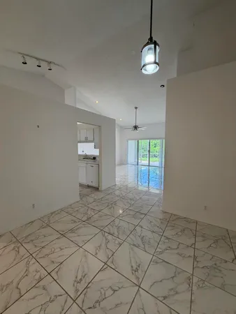 a kitchen with stainless steel appliances a refrigerator and a stove