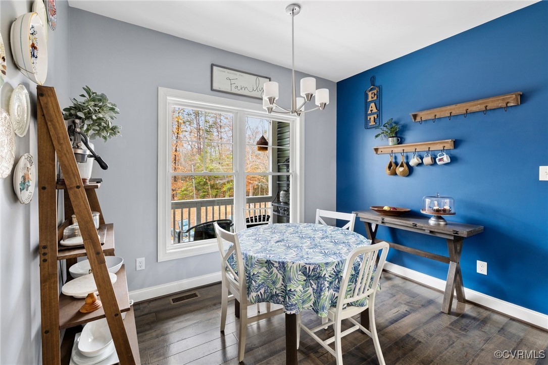 2802 Perkinsville Road Maidens, VA 23102 - Photo 13 of 40 a view of a dining room with furniture window and wooden floor