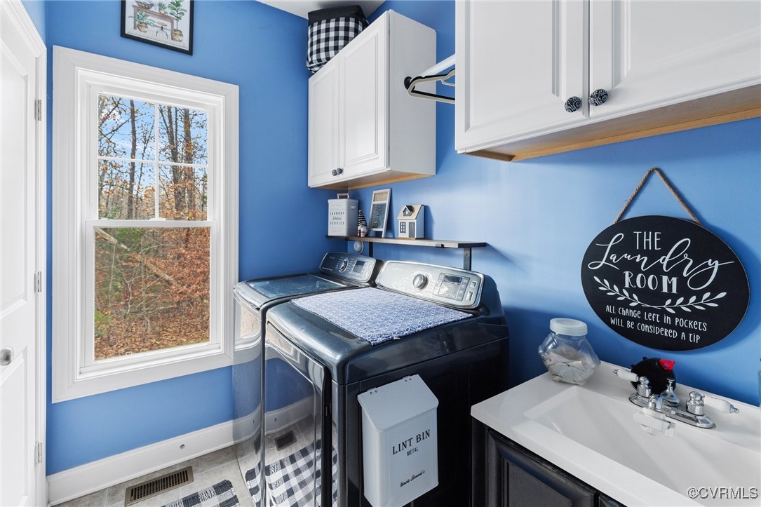 2802 Perkinsville Road Maidens, VA 23102 - Photo 21 of 40 Laundry room with tile patterned floors, washer an