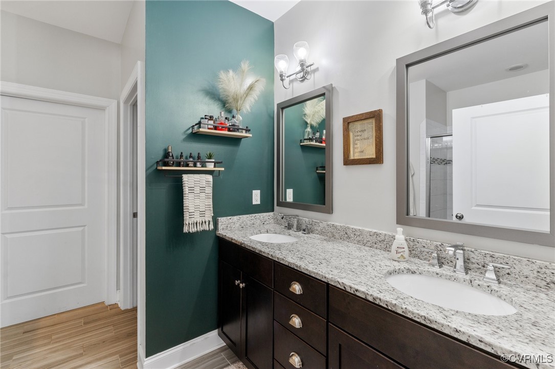 2802 Perkinsville Road Maidens, VA 23102 - Photo 25 of 40 a bathroom with a granite countertop sink vanity and mirror