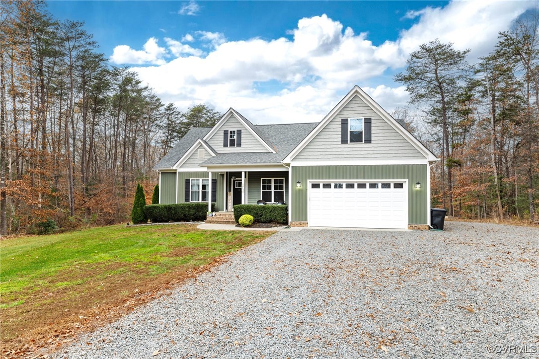 2802 Perkinsville Road Maidens, VA 23102 - Photo 3 of 40 a front view of a house with a yard and garage