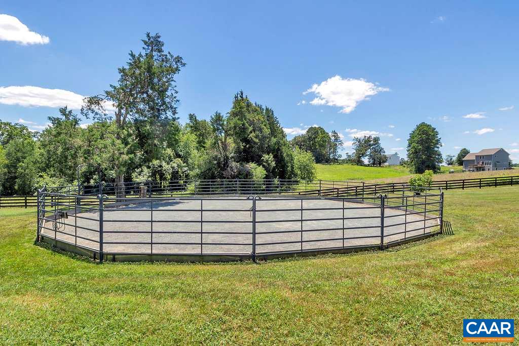 846 Troy Road Troy, VA 22974 - Photo 22 of 49 a view of a garden with a bench in the background