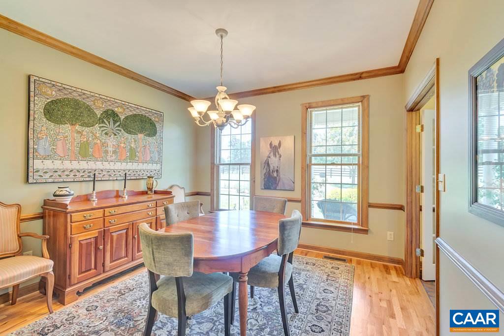 846 Troy Road Troy, VA 22974 - Photo 30 of 49 a view of a dining room with furniture a chandelier and wooden floor