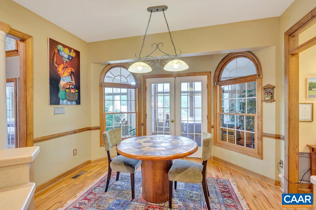 846 Troy Road Troy, VA 22974 - Photo 34 of 49 a view of a dining room with furniture a chandelier and wooden floor