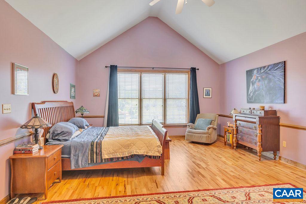 846 Troy Road Troy, VA 22974 - Photo 36 of 49 a bedroom with a bed and wooden floor