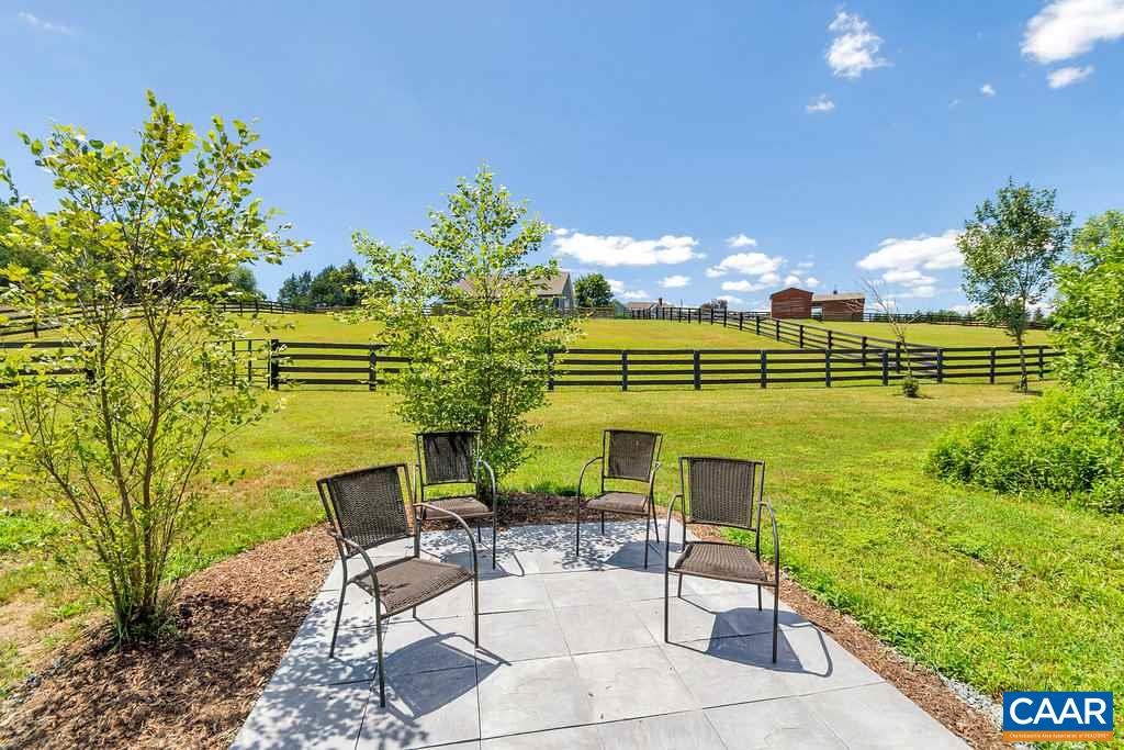 846 Troy Road Troy, VA 22974 - Photo 48 of 49 a view of a lake with a garden and outdoor seating