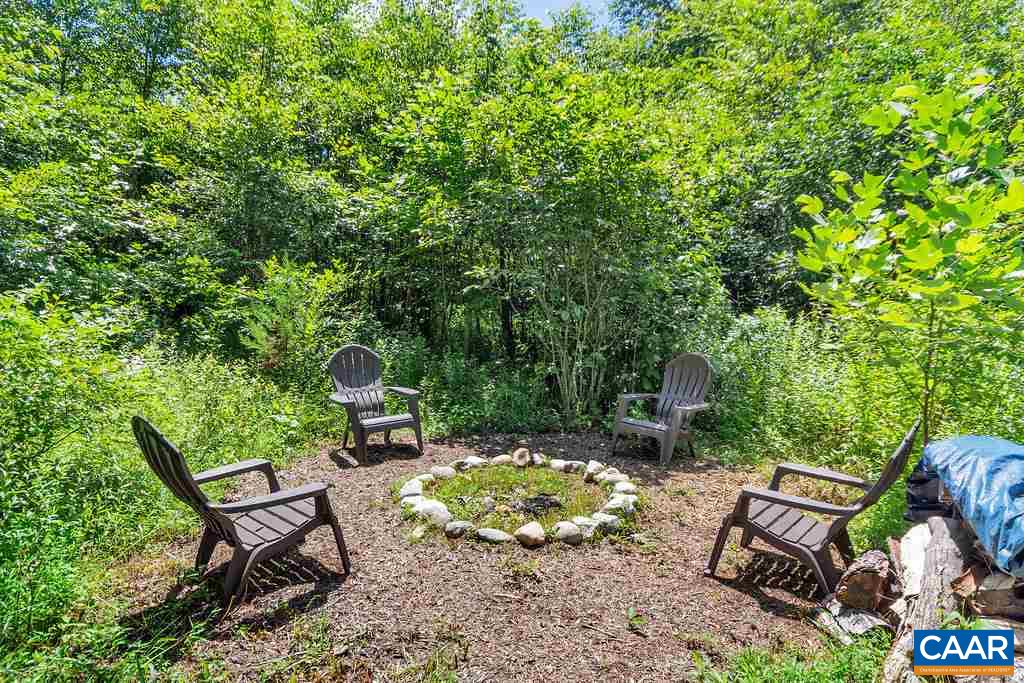 846 Troy Road Troy, VA 22974 - Photo 49 of 49 a backyard of a house with table and chairs