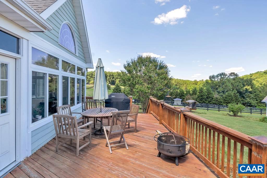 846 Troy Road Troy, VA 22974 - Photo 8 of 49 a view of a patio with a table chairs and a table