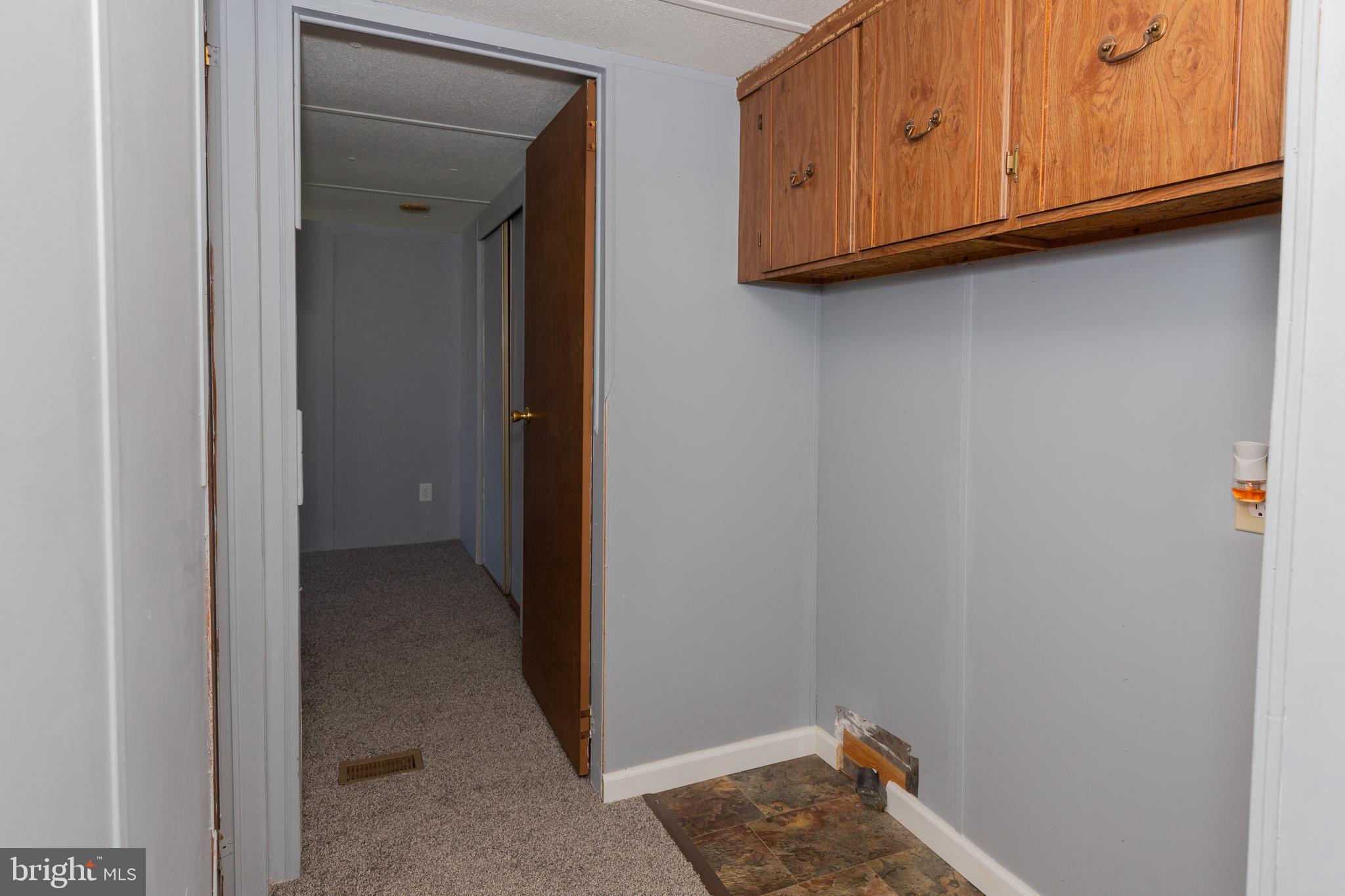 90 Fabric Drive Bunker Hill, WV 25413 - Photo 12 of 28 a view of hallway with washer and dryer