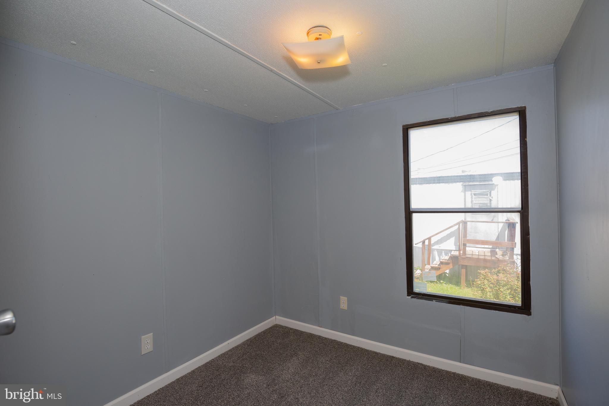 90 Fabric Drive Bunker Hill, WV 25413 - Photo 16 of 28 an empty room with windows