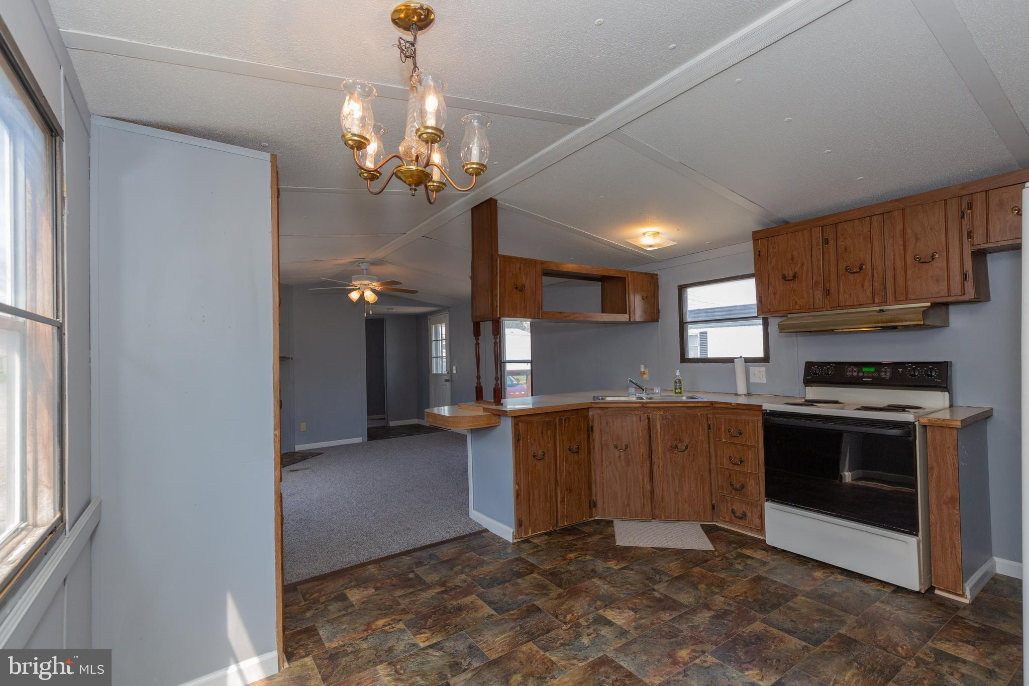 90 Fabric Drive Bunker Hill, WV 25413 - Photo 19 of 28 a kitchen with stainless steel appliances granite countertop a refrigerator and a stove top oven
