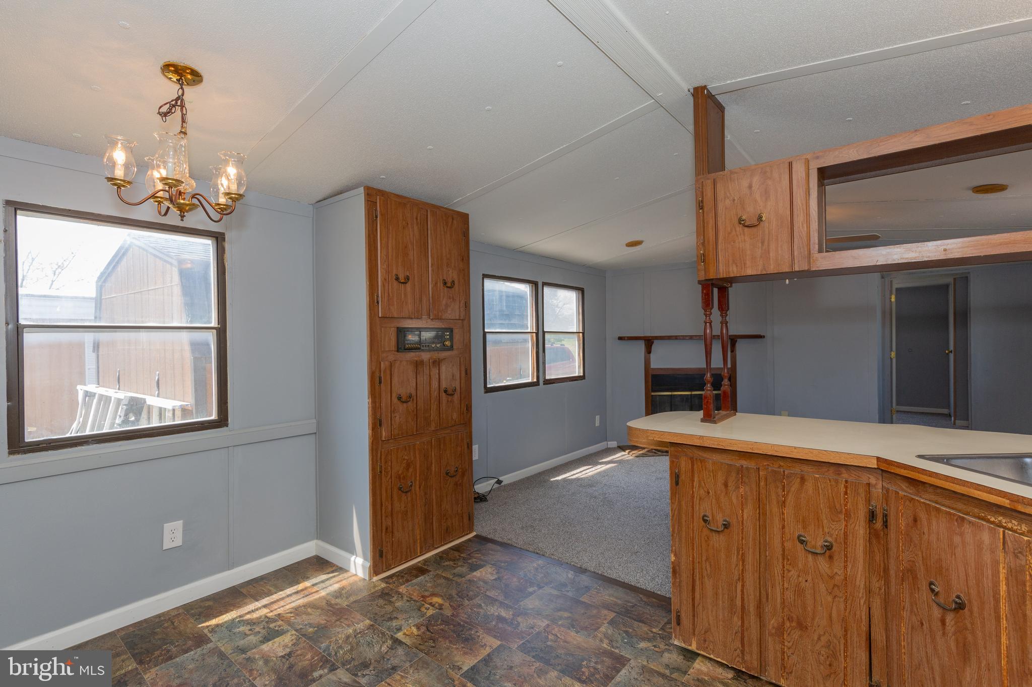 90 Fabric Drive Bunker Hill, WV 25413 - Photo 21 of 28 a view of kitchen with granite countertop cabinets and window