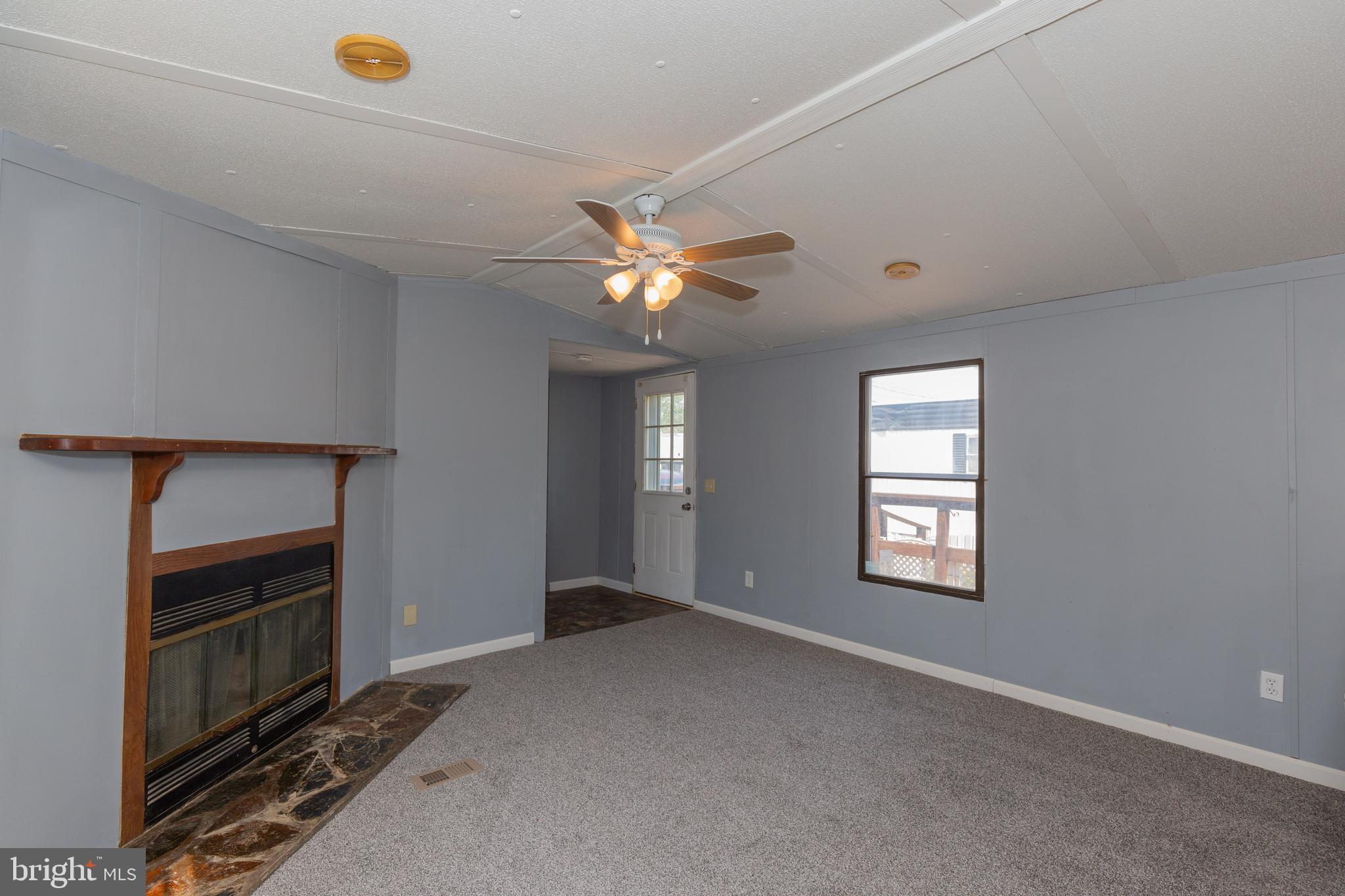 90 Fabric Drive Bunker Hill, WV 25413 - Photo 23 of 28 a view of an empty room with a window