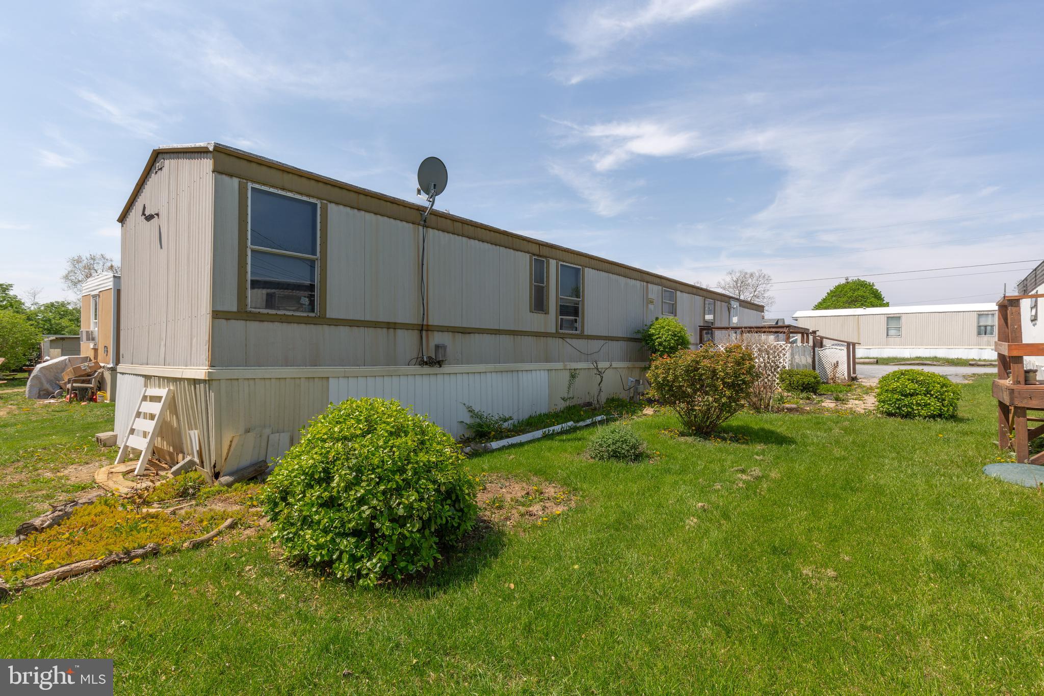 90 Fabric Drive Bunker Hill, WV 25413 - Photo 3 of 28 a front view of a house with garden