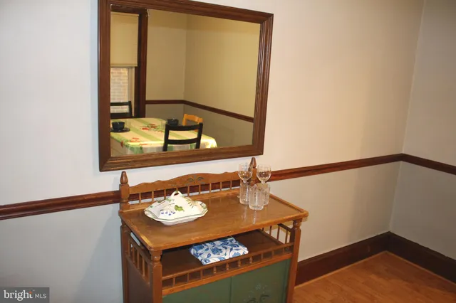 a kitchen with white cabinets and a sink