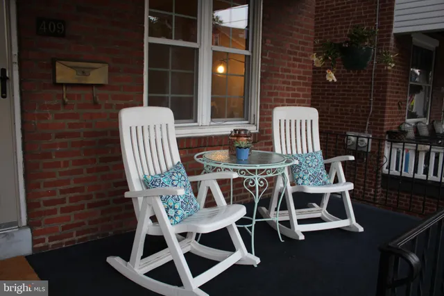 a table with a lamp and a window