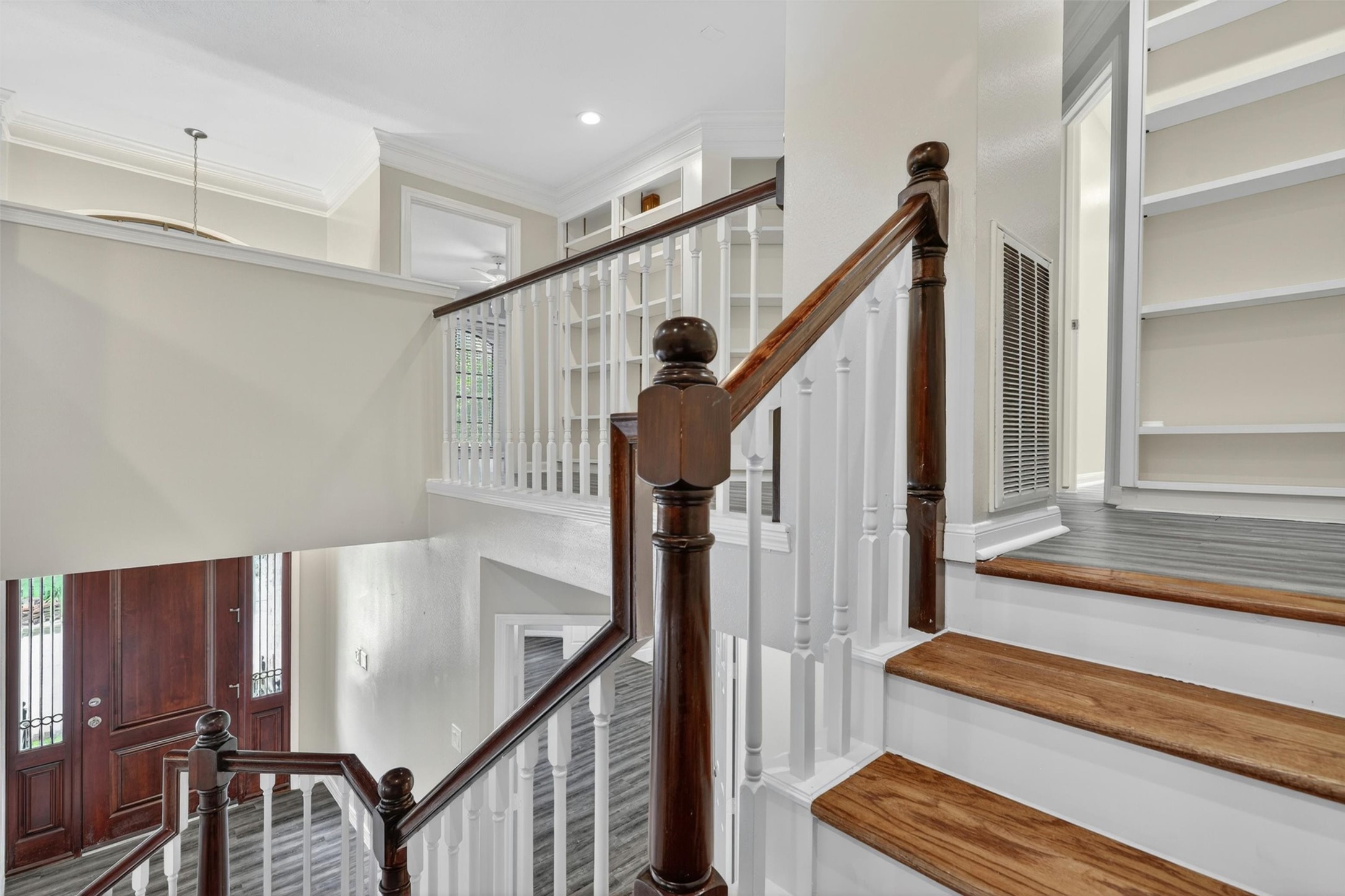 12929 Kingsbridge Lane Houston, TX 77077 - Photo 42 of 42 Make a lasting impression with this stunning multi-level staircase and elegant architectural design that adds character and sophistication throughout the home. Featuring rich wood stair accents, soaring ceilings, custom built-in shelving, and an open airy layout, this space creates a true luxury feel from the moment you enter. Buyers will love the dramatic visual appeal, abundant natural light, and thoughtfully designed floor plan perfect for modern living.