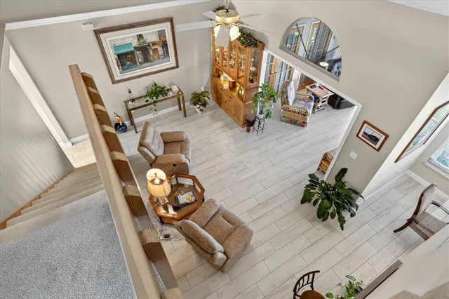 a view of living room with furniture and wooden floor