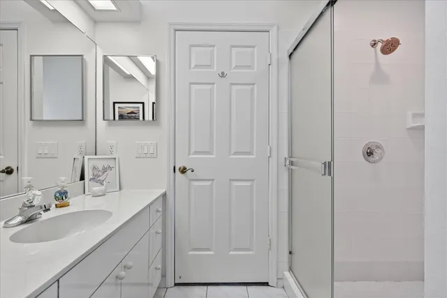 a bathroom with a sink and mirror