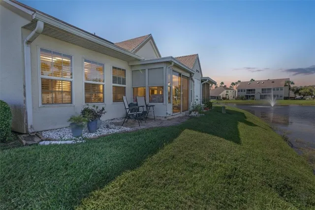a front view of house with yard and outdoor seating