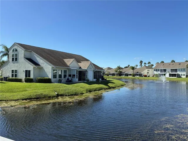 a front view of a house with a lake view
