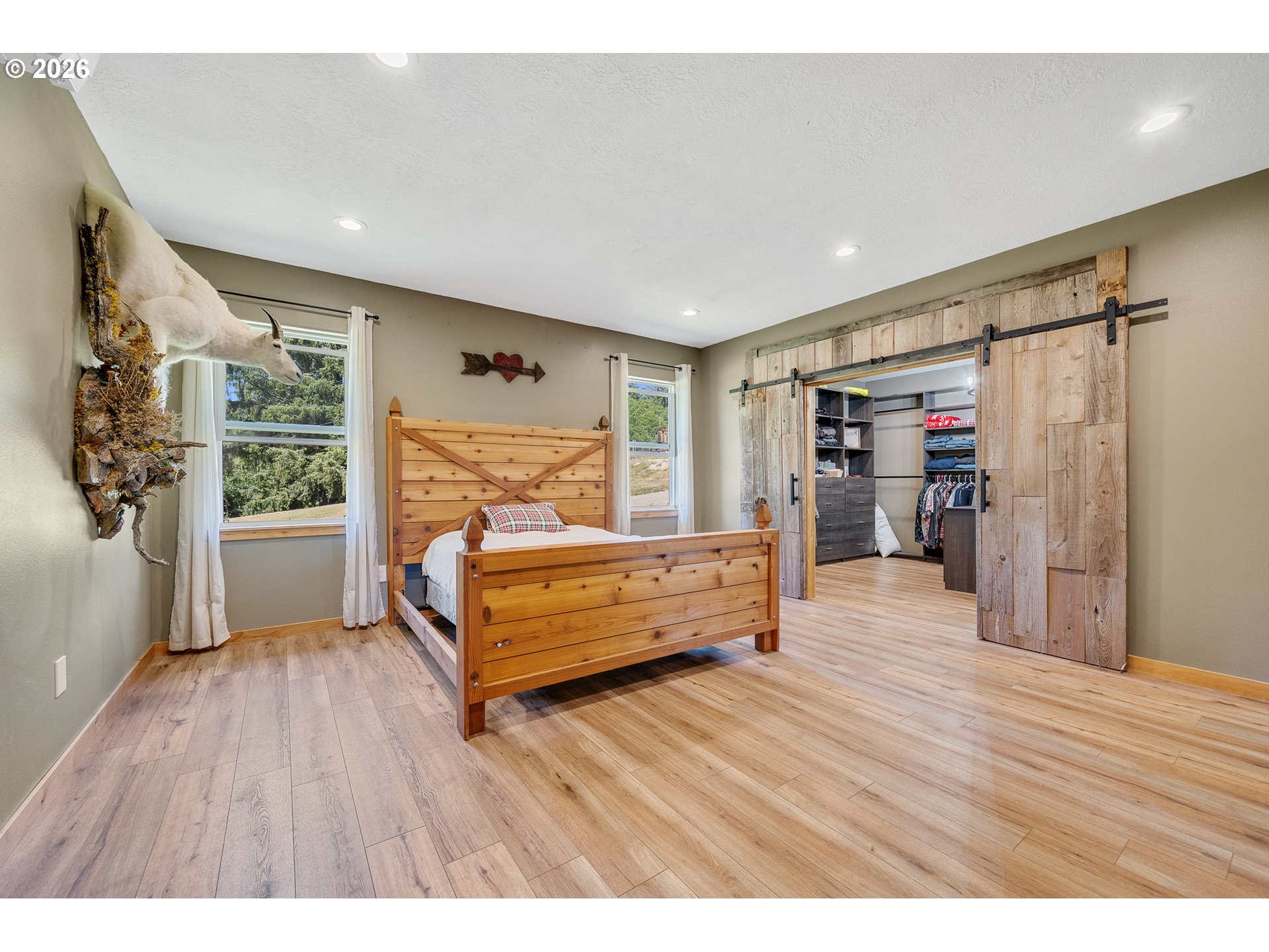 850 Hodgdon Road Tillamook, OR 97141 - Photo 21 of 43 a spacious bedroom with a bed and a window