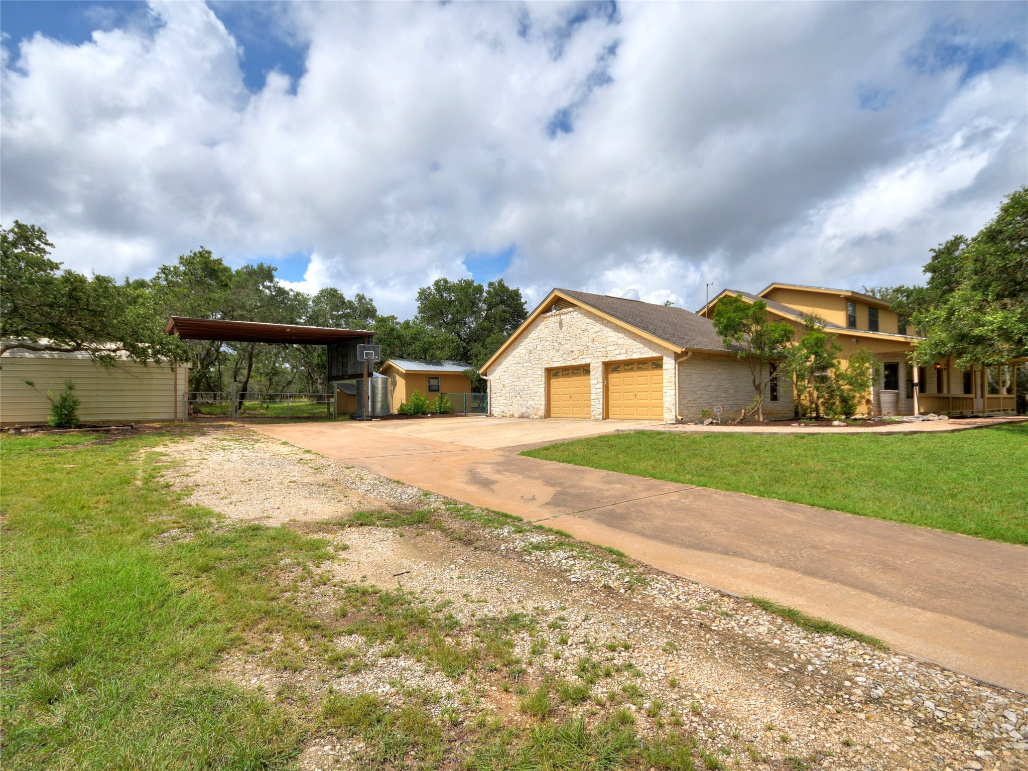 328 Fawnridge Street Georgetown, TX 78628 - Photo 23 of 33 House featuring covered RV storage, metal workshop, and garden shed. 2-Car attached garage. Plenty of driveway parking.