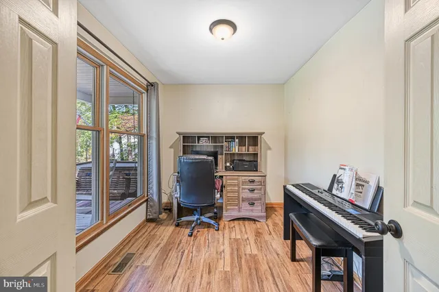 a workspace with furniture and wooden floor