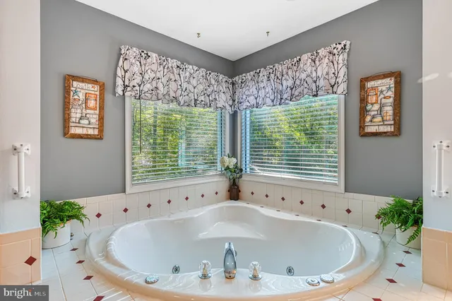 a bathroom with shower and bathtub