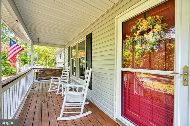a view of a two chairs in the balcony