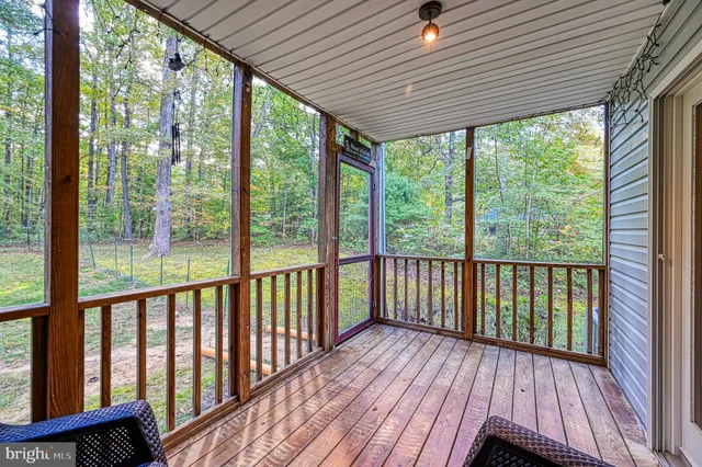 a view of a two chairs in the balcony