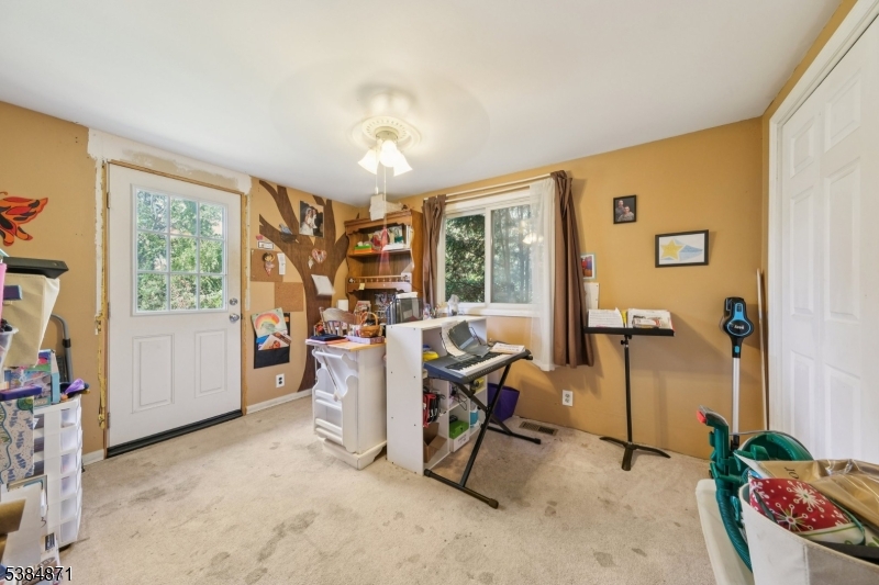 47 Thomas Street Monroe Township, NJ 08831 - Photo 7 of 19 a view of a workspace with furniture and a window