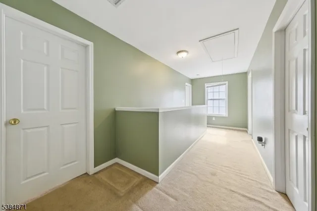 a bedroom with bunk bed and a window