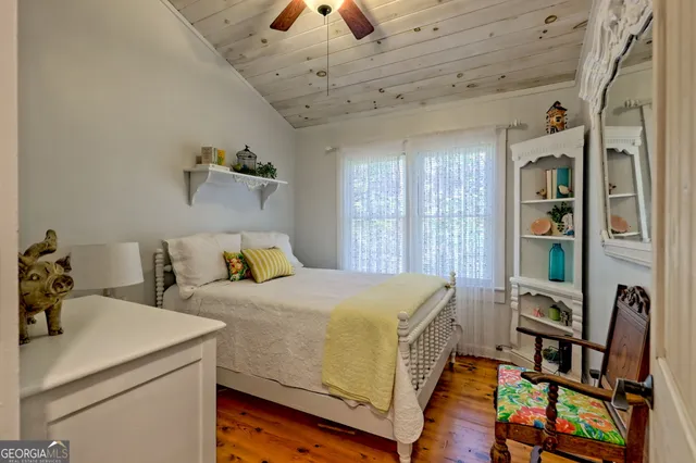 a bedroom with a bed and a table in it